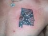 Rebal flag tattoo on chest